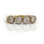 A gold ring, collet set with a row of four circular cut diamonds, apparently unmarked, ring size Q,