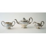A group of silver tea wares, comprising; a teapot of squat circular form,