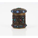 An Asian silver gilt, enamel, turquoise and coral set cylindrical container and cover,