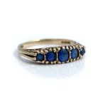 A 9ct gold and sapphire five stone ring, mounted with a row of graduated sapphires,