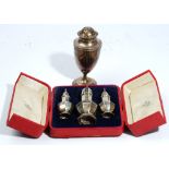 A cased set of three George I style silver octagonal caster and pepperettes, Jays, Chester 1909, 9.