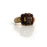 An early 19th century carbuncle garnet and rose cut garnet set ring,