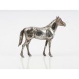 A silver model of a standing horse, London 1978, height 24cm, maker Asprey & Co Ltd,