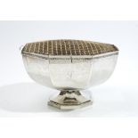 A silver rose bowl, of octagonal form, decorated with a cast rim, raised on an octagonal foot,