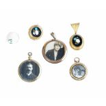 A gold mounted Florentine pietra dura oval pendant locket, in a floral design,