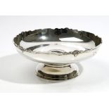 A silver centrepiece bowl, of circular form, the cast shaped rim with palmette motifs at intervals,