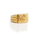 A gold signet ring, monogram engraved, decorated with ridged shoulders, detailed 18 CT, ring size L,