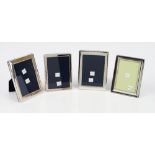 A near pair of silver mounted plain rectangular photograph frames,
