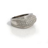 A diamond ring, in a curved elongated cluster design, pave set with circular cut diamonds,