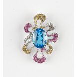 An 18ct white gold, blue topaz, diamond, ruby and yellow sapphire set pendant,