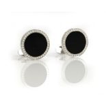 A pair of white gold, diamond and black onyx dress cufflinks,