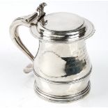 A late Victorian Britannia standard silver, large hinge lidded tankard, the body of baluster form,