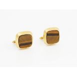 A pair of 9ct gold mounted tiger's eye cufflinks, each with a curved square front,
