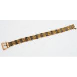 A 15ct tri-gold mesh-link bracelet of belt design, the buckle detailed '15ct',