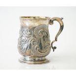 A George II silver mug, of baluster form, with later foliate and scroll embossed decoration,