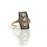 A platinum fronted gold, diamond and synthetic sapphire ring, in a panel shaped design,