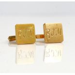 A pair of gold cufflinks, the square fronts initial engraved,