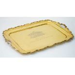 A silver gilt shaped rectangular twin handled tray,