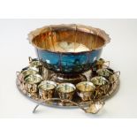 A silver plated punch bowl, having a shaped rim and panelled sides, a King's pattern punch ladle,