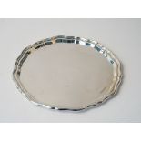 A silver salver of shaped circular form, Sheffield 1936, weight 494 gms, diameter 26cm.