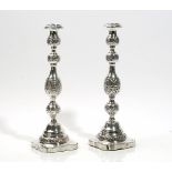 A pair of silver table candlesticks,