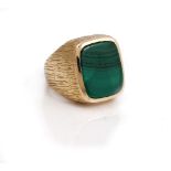 A 9ct gold and malachite gentleman's signet ring, mounted with a curved rectangular malachite,