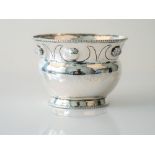 A silver vase in an Arts & Craft's design,