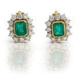 A pair of 18ct gold emerald and diamond set earclips of cluster design,