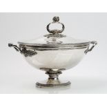 A French twin handled tureen and cover, of oval form, decorated in the Empire style,