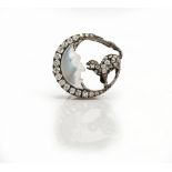 A late 19th/early 20th Century carved moonstone and diamond set man-in-the-moon and cat brooch of