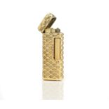 A two colour gold mounted curved rectangular cased gas lighter,