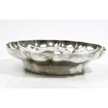 A silver bowl of lobed shaped circular form, retailed by Harrods, diameter 23.