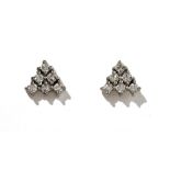 A pair of diamond earstuds, each claw set with six circular cut diamonds in a triangular design,