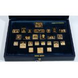 A set of twenty-five silver gilt replica postage stamp ingots,