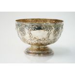 A late Victorian sliver rose bowl, embossed with fruit, foliate scrolls and flowers,