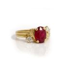 A gold, ruby and diamond three stone ring,