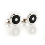 A pair of white gold, diamond and black onyx dress cufflinks,