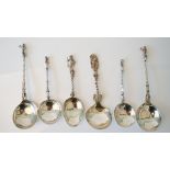 A group of European flatware, comprising; a pair of spoons having spiral handles,