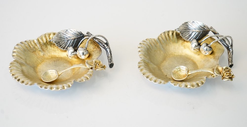 A pair of Italian silver salts, each of cast flowerhead form, lightly gilt,