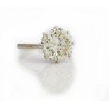 A single stone diamond ring, the brilliant cut diamond measuring 10.38mm x 10.44mm x 6.