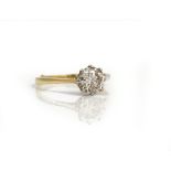 An 18ct gold and diamond single stone ring, claw set with a circular cut diamond,