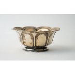 A European bowl, of octagonal shaped oval panelled form, within a shaped rim,
