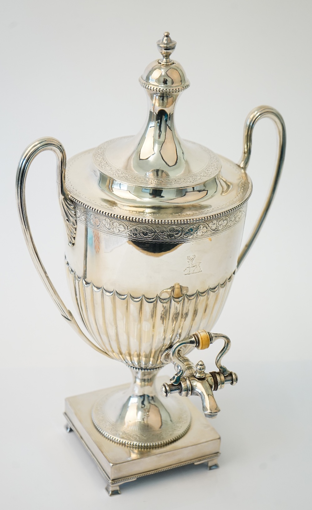 A Victorian silver twin handled hot water lidded urn, of Adam form,