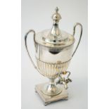 A Victorian silver twin handled hot water lidded urn, of Adam form,