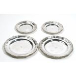 Silver, comprising; a pair of shaped circular dishes, each decorated with a gadrooned rim,