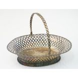 A late George II silver cake basket of oval form,