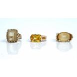 A 9ct gold ring, claw set with an oval cut citrine, a 9ct gold ring,