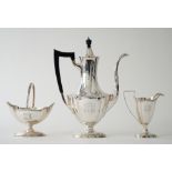 An American Sterling silver three piece coffee set, comprising; a coffee pot having black fittings,