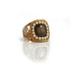 A gold and seed pearl set mourning ring,