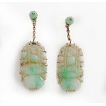 A pair of gold mounted jade pendant earrings,